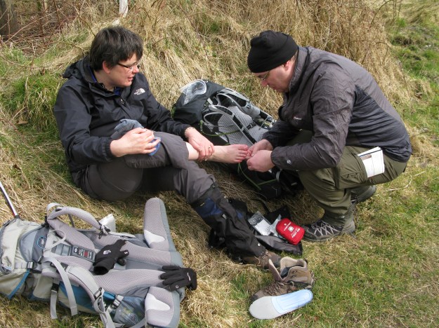 Attend to foot problems as soon as possible. A slight problem can quickly become major. This brief halt on the West Highland Way in 2014 got rid of a tiny piece of grit before anything could develop