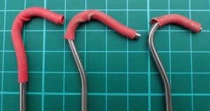 Heads of shepherds crooks come in a variety of forms. Some are more suited to a downward force for putting pegs in, others are more resistant to the guy slipping off while some are easiier to hok a finger under to remove them from the ground