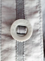 The 'Soldier '95' style buttons have been used by some outdoor clothing manufacturers but are troublesome to replcae if they are broken or lost, being designed to be fixed in place with a tape running through them