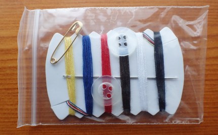 A typical 'hotel' sewing kit. There is little here that is of practical use on outdoor clothing. Cotton thread isn't robust enough, nedles lack strength, safety pin is tiny and buttons are unrepresentative of what will have actually got lost. being too small in most instance