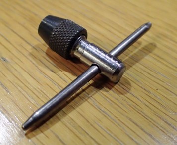 A short titanium tent peg was cut down to 55mm and the whole through the body drilled out to 3mm so that the T piece would fit. Again, all sawn edges cleaned up with a file