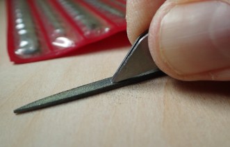 Careful filing of the points of the titanium Sliver Gripper tweezers corrected the poor manufacturing finish and bought the points together