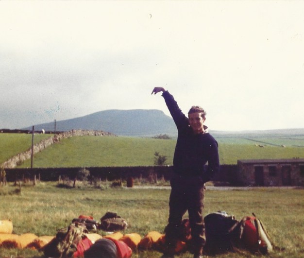 In the 1980s, with friends I scaled hills and mountains in various regions of the UK. My pal Kenny Emerson points out Scafell Pike, soon after we had finished running up and down it- Ordnance Survey had, needless to say, shown the way