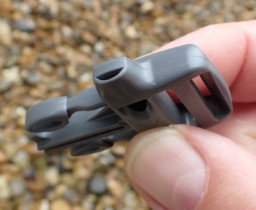 Large combined pack buckle and whistle