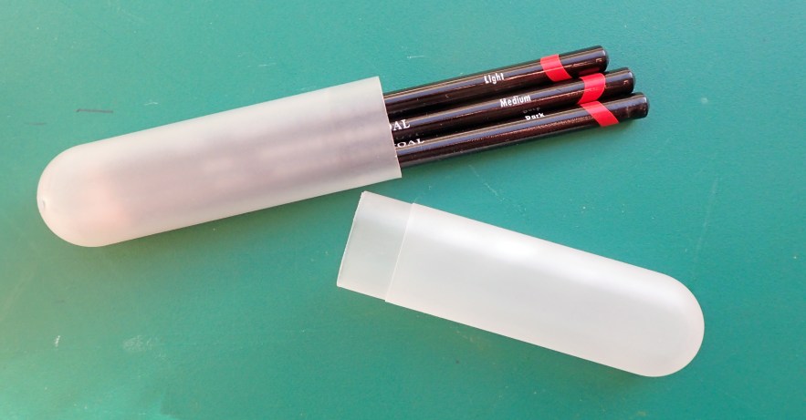 Plastic toothbrush holders make a good, sturdy holder for pencils however they will not hold much selection. The one shown here has three of the Derwent Charcoal pencils in it but I do not find charcoal pencils suitable for the trail as drawings really require a spray fixative