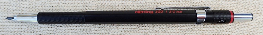 The Rotring 300 clutch pencil is a handsome product. It has a plastic body and takes 2mm leads. The knurled grip is comfortable in the hand but can slip if wet. A handy feature is the rotating band that indicates the hardness of lead fitted. There is an 'OK' sharpener in the cap. It weighs 13.2g with lead fitted