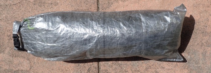 Having removed a small roll of repair tape included in the tent and a little paperwork that came with it. I have repacked the tent into a newly purchased cuben long, thin dry bag from Z Packs. Total weight, minus poles and pegs is 632g
