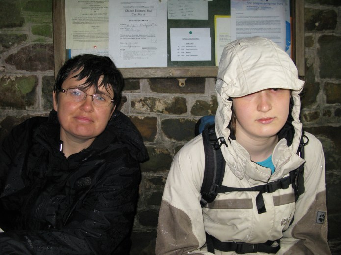Sometimes, a church just provides a little shelter. Three Points of the Compass and his family took shelter from the heavy rain in a church porch while completing the Two Moors Way in 2012