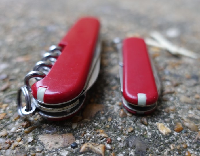 Large and small Firefly inserted into the slots provided for toothpicks on my Victorinox Spartan and Classic SD Swiss Army Knives