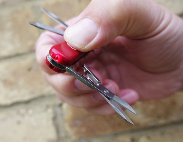 Victorinox Signature Lite with red LED. The light is operated by pressing down the shield on the scale