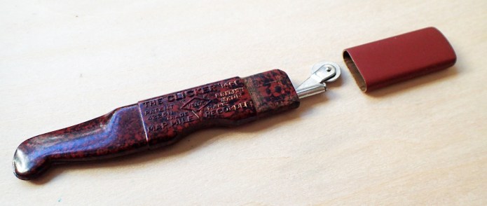 Velos Clicker- Model 1460. Brown bakelite handle