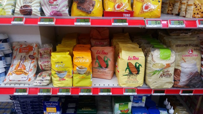 Gofio on in Gran Canaria supermarket, stacked beside sugars and condensed milk