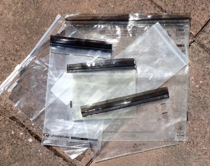 Three Points of the Compass has tried using simple plastic resealable bags including those from Lifeventure and Loksac. Any of these are fine for a few days but eventually, after a few days of use and constantly being opened/closed eventually fail