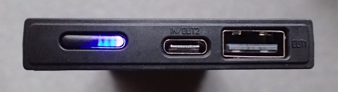 The 'business end' of NireCore NB10000. Blue LEDS show charge status, pressing and holding the mode button switches on the white LED and will then safely support charging of low current devices such as wireless headphones
