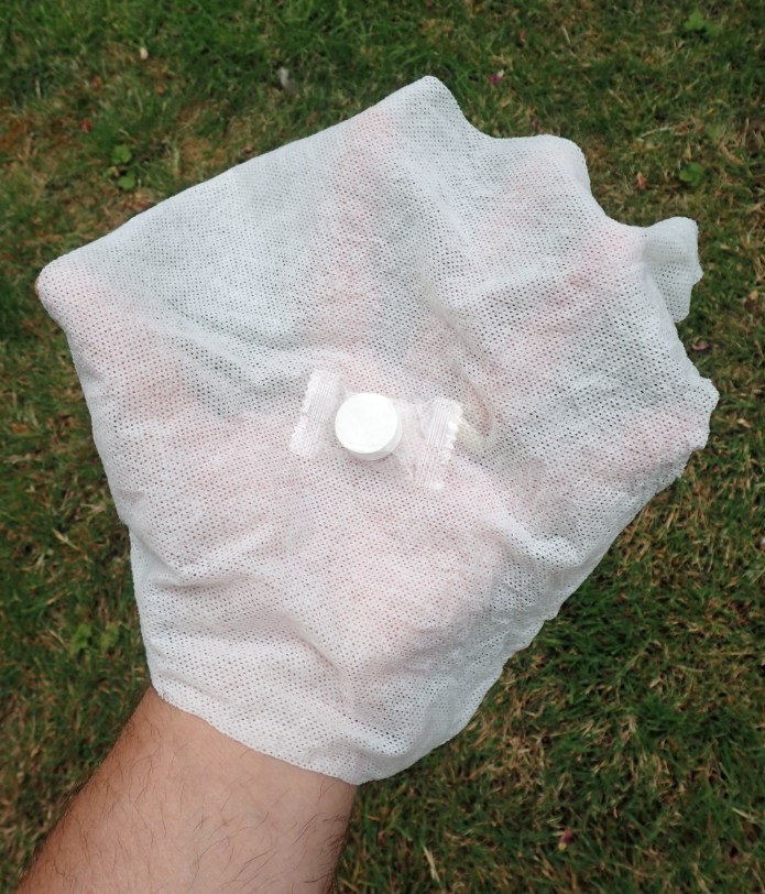 Sealed towel 'puck', and an uncompressed and wetted towel- large enough to cover my hand