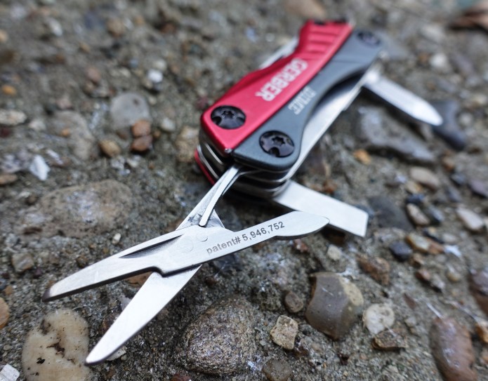 Very small pair of spring loaded scissors are sharp but will only handle very light work