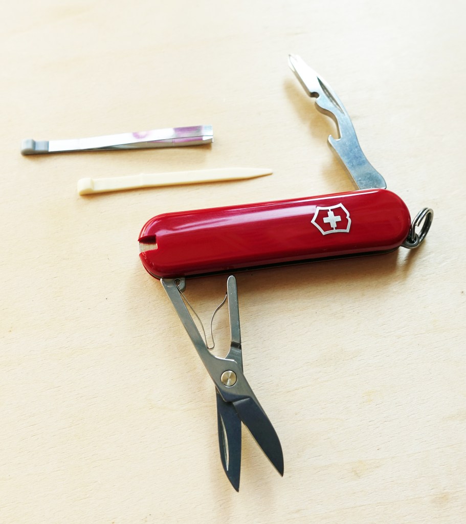 The 58mm 21.3g Victorinox Jetsetter (model- 0.6263) is an 'airline friendly' tool that excludes a knife blade- the only tools found are scissors, combi-tool, toothpick, tweezers and keyring. An expanded version of this tool can include a thumb drive, then becoming the Jetsetter@work tool