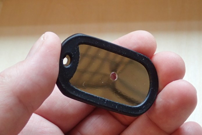Small polished metal 'dog tag' mirror