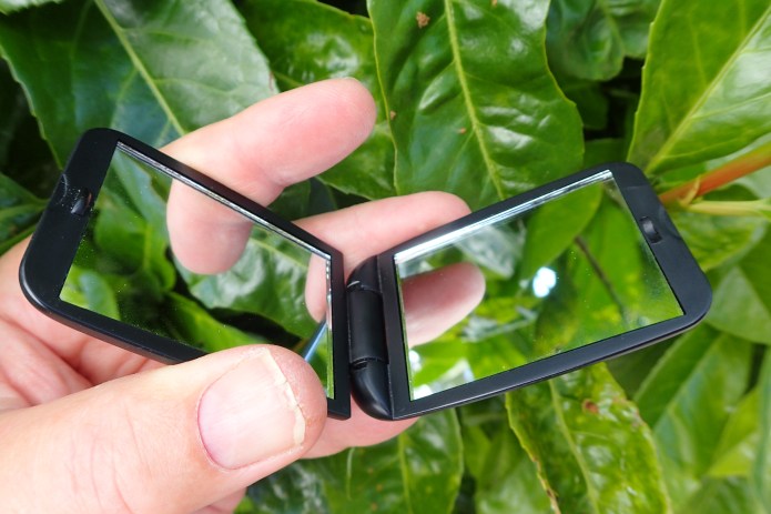 Small double faced glass mirror in plastic clamshell case