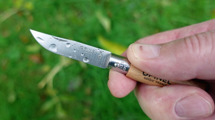 Using an Opinel No. 4 on a wet day. Stainless steel knives will survice these damp conditions well, however the carbon variants require extra care to prevent corrosion