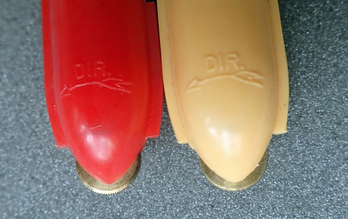 The direction of use for the brass tracking wheel is shown on the instrument's body