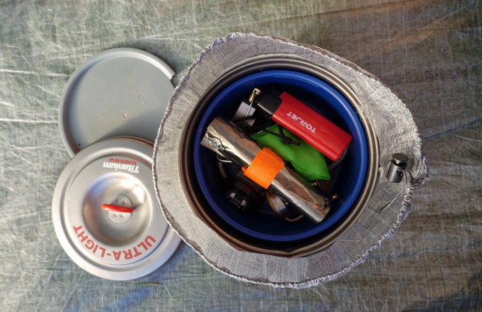 Evernew 900ml pan with GSI mug. Inside these is the collapsed and coiled Kovea Spider, butane gas canister adapter, titanium foil windscreen, torjet lighter and even a spare gas stove- the BRS 3000-T