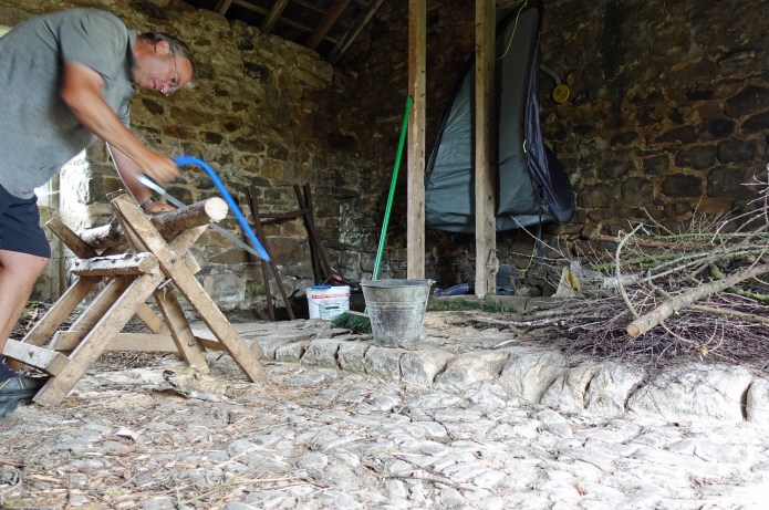 Cutting wood in the adjacent fuel store at Houghton