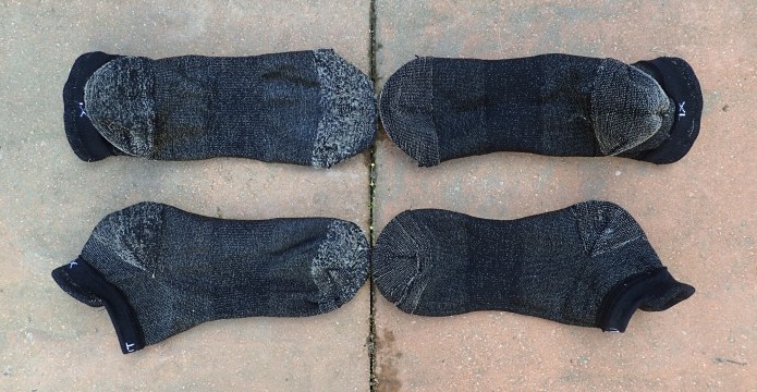 Silverlight socks on the left have completed over one hundred trai miles, compared with new pair on right. All socks are turned inside out