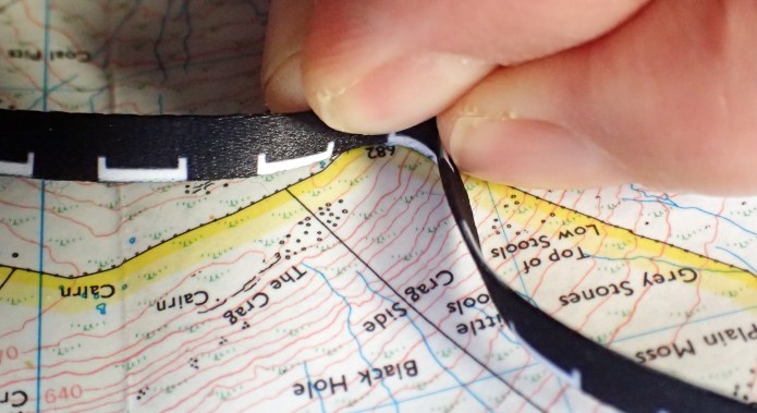 The Silva lanyard measure works best when used on edge to track curves and bends on a map
