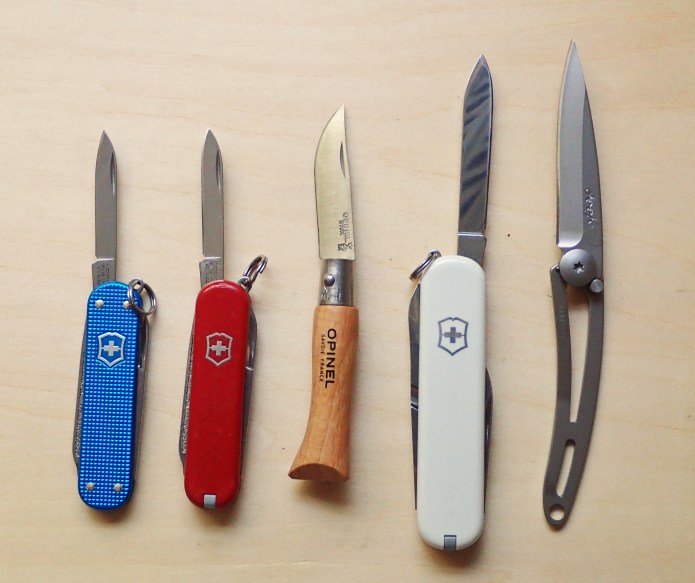 Blades compared- Victorinox Classic SD, Victorinox Classic SD, Opinel No. 3, Victorinox Ambassador, Deejo 15g
