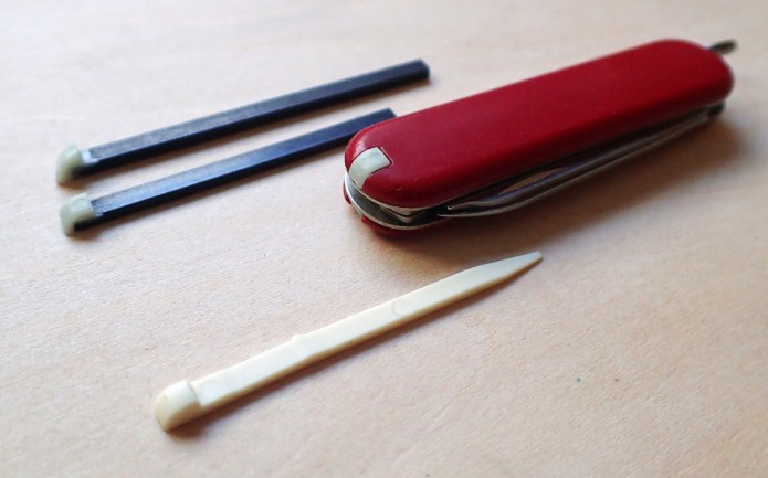 Far more useful than a toothpick is a mini ferrocerium rod inserted into a Victorinox scale slot. The two sizes of Firefly rod are shown here, a small one is also in the knife scale