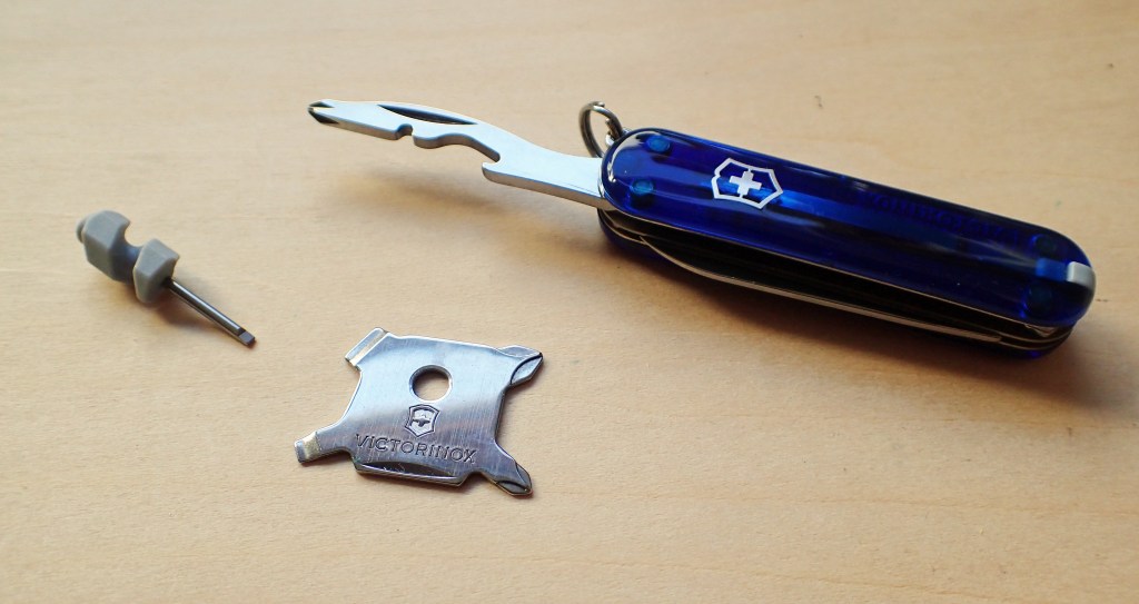 Combination tool on a Victorinox Midnite Manager, this includes a Phillips scredriver tip. Plus two further screwdriver options from Victorinox- the miniscule 'glasses' screwdriver, and the four-point 'Quattro' screwdriver found in some SwissCards
