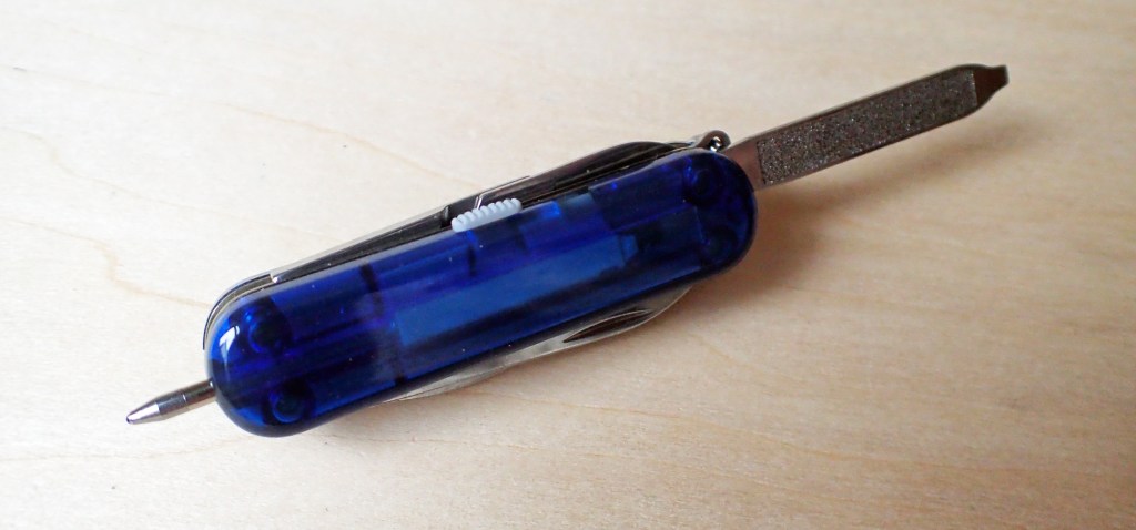 Victorinox Midnite Manager comes with a with small pen. Opening the nailfile makes this easier to hold and use in the hand