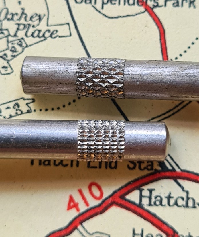 Some differences in the manufacture of the Universal measure are very small indeed, such as a change in the knurling on the handle