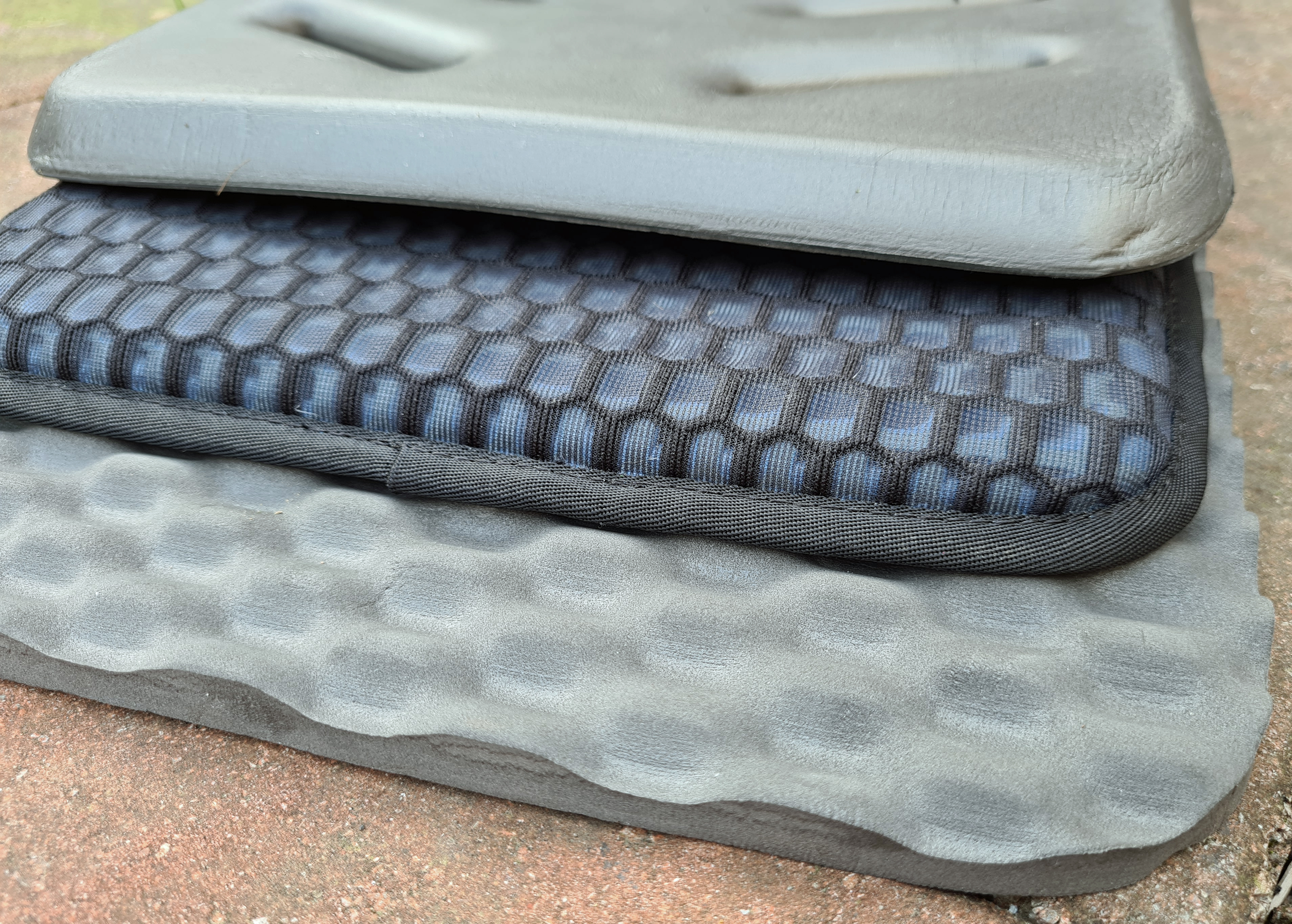 ends of three Gossamer Gear sit pads compared