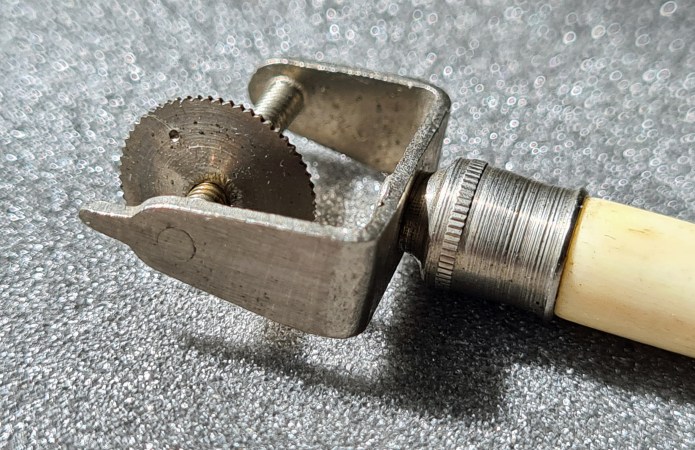 Tracking wheel on Curvimeter. Just visible is the small stamped dot on the wheel