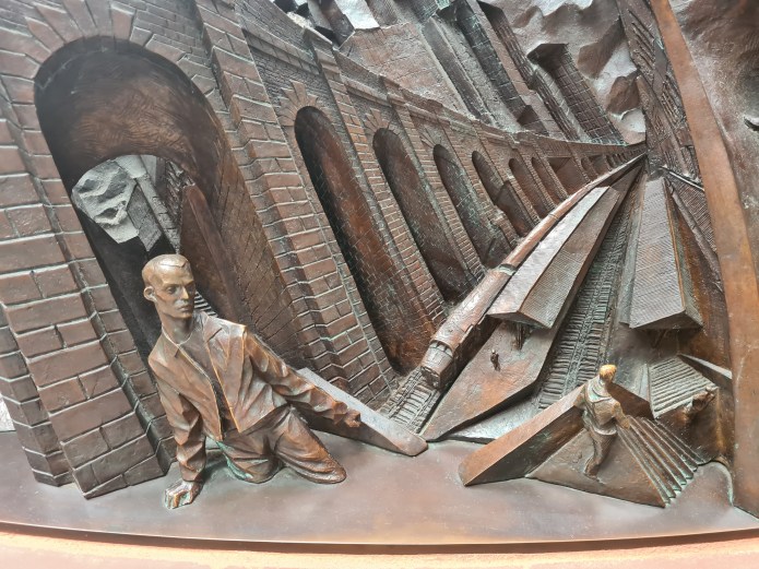 Detail from bronze relief frieze of The Meeting Place