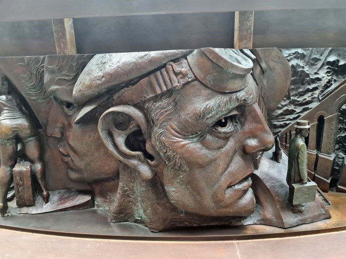 Detail from bronze relief frieze of The Meeting Place