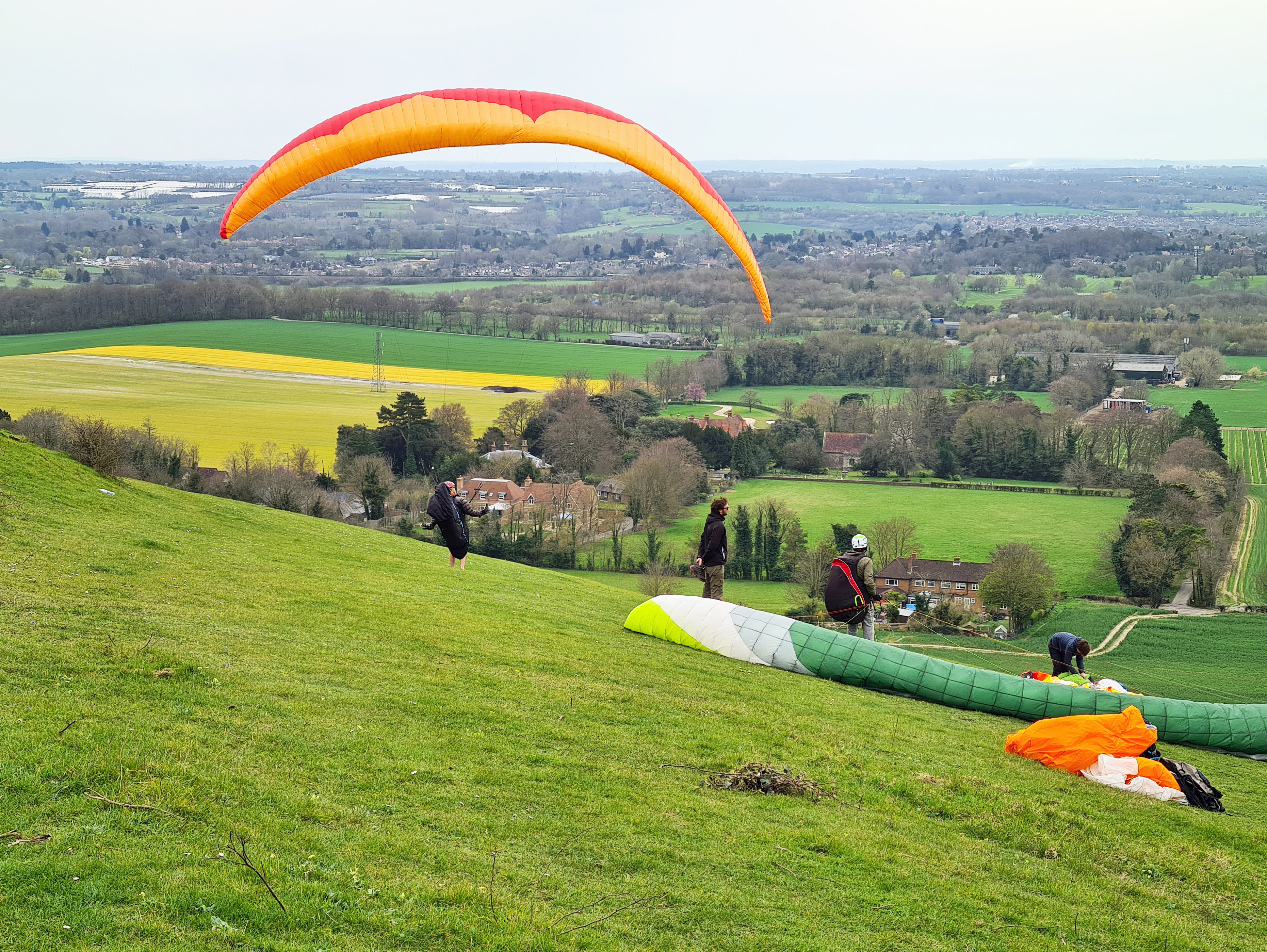 Paragliders on the North Downs Way above Thurnham