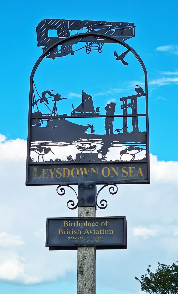 Pierced metal sign at Leysdown on Sea shows not only local wildlife but focuses on its place in aviation history
