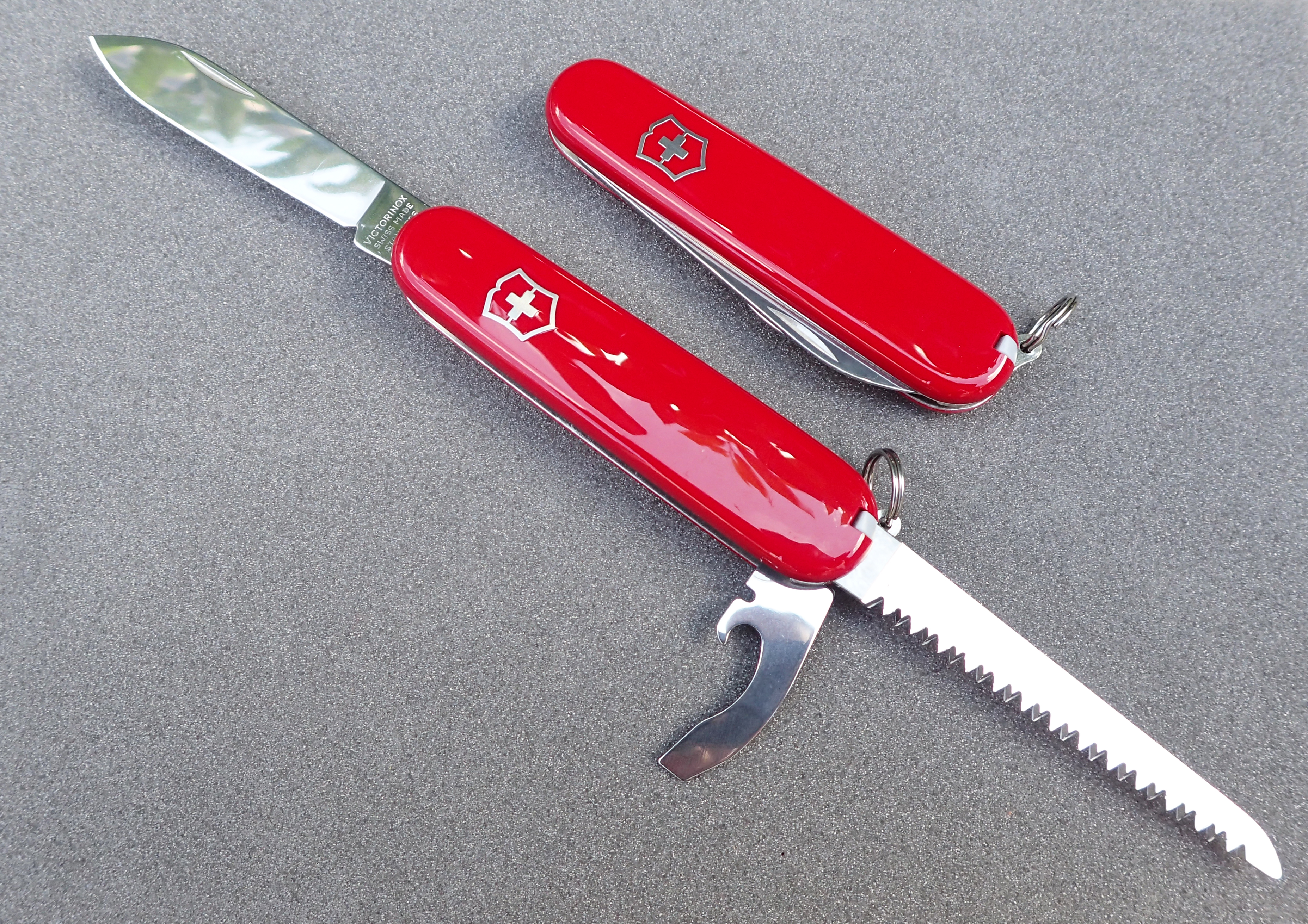 84mm Victorinox Walker with all tools open, with closed 84mm Victorinox Bantam