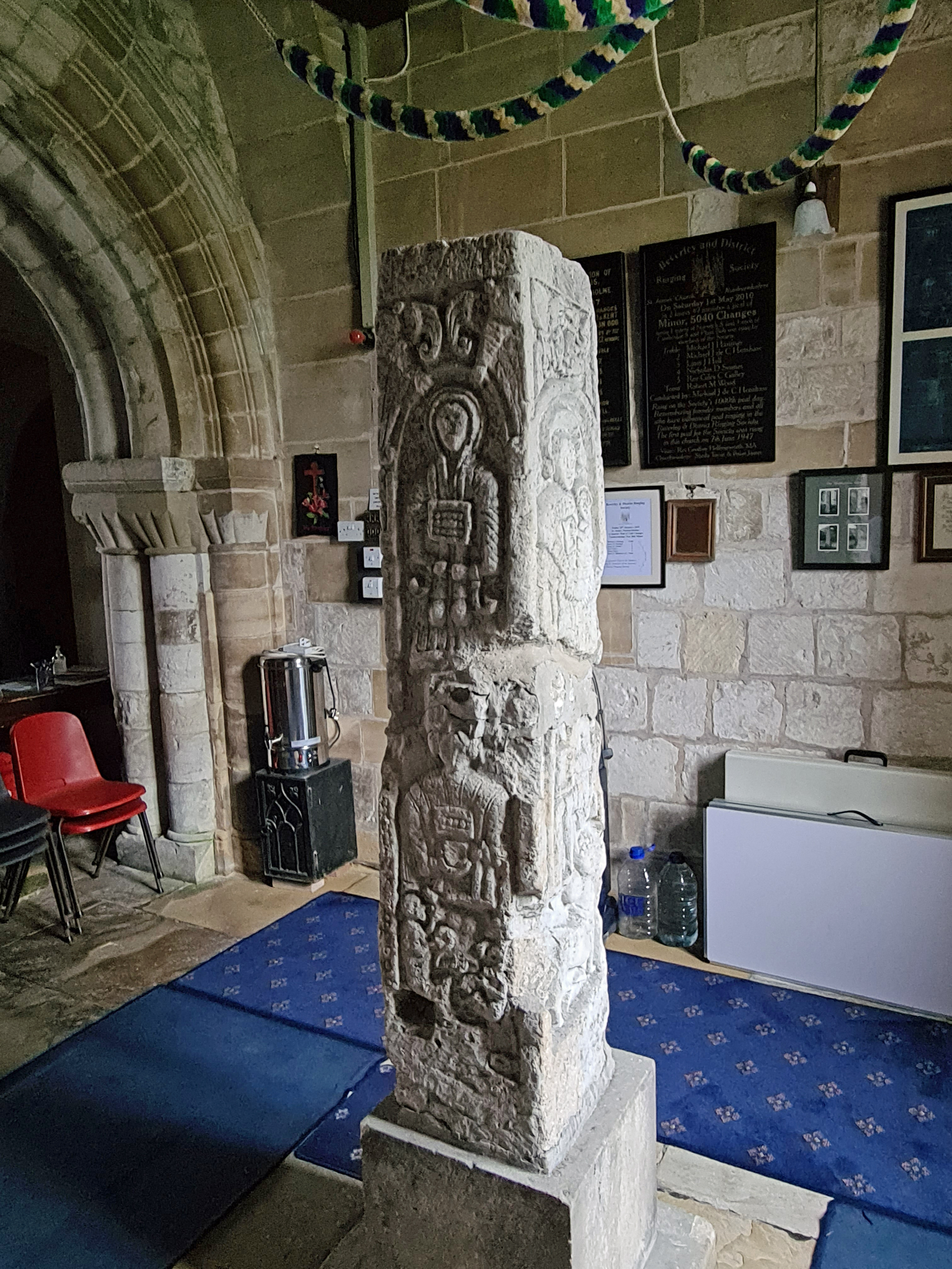 Nunburnholm Cross. Missing it's central spar now, today's bell-ringers (ropes looped above the cross) will stand around it to ring