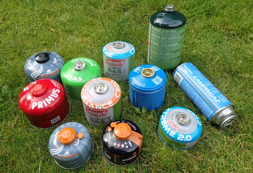 Most of these gas canisters have the EN 417 Lindal connectors, however three on the right do not. These are the large propane canister and two Campingaz canisters, each with a different connector type