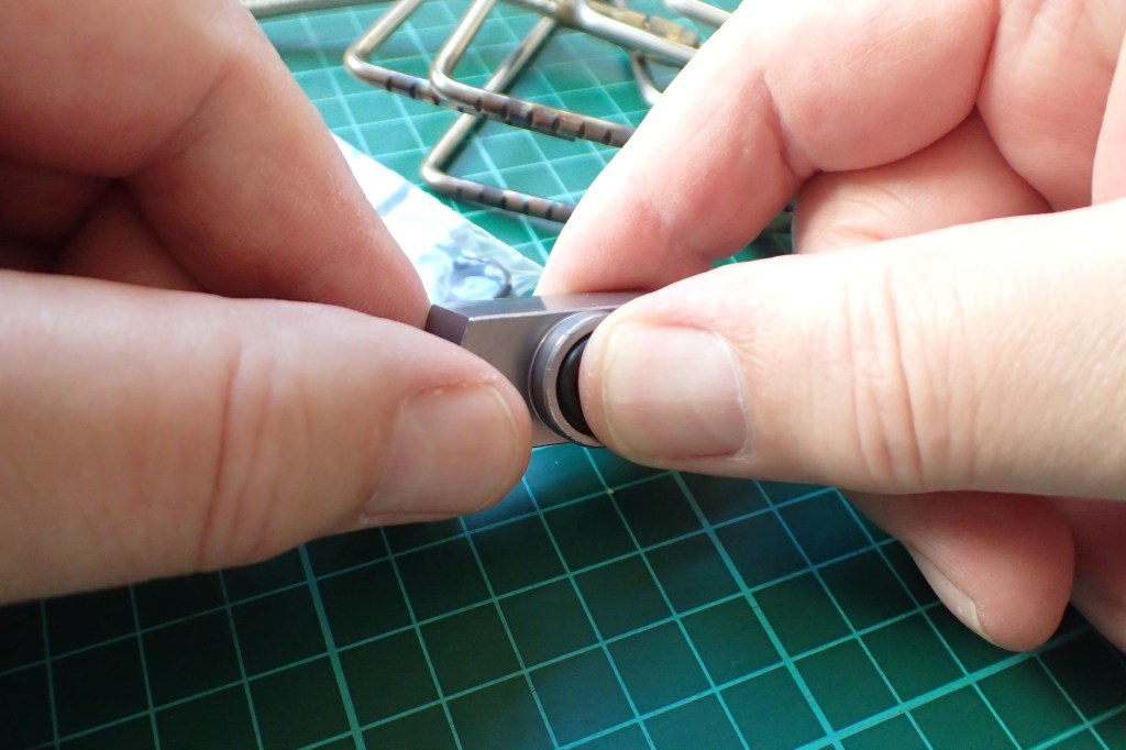 Pushing replacement O-ring past first few threads of connector