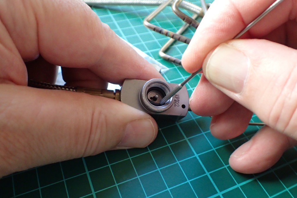 Gently easing replacement O-ring in to its seat with blunt end of pick