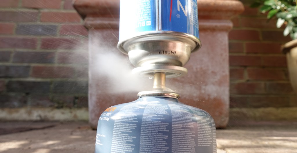 There will be a brief venting of gas when pushed home, this will quickly cease