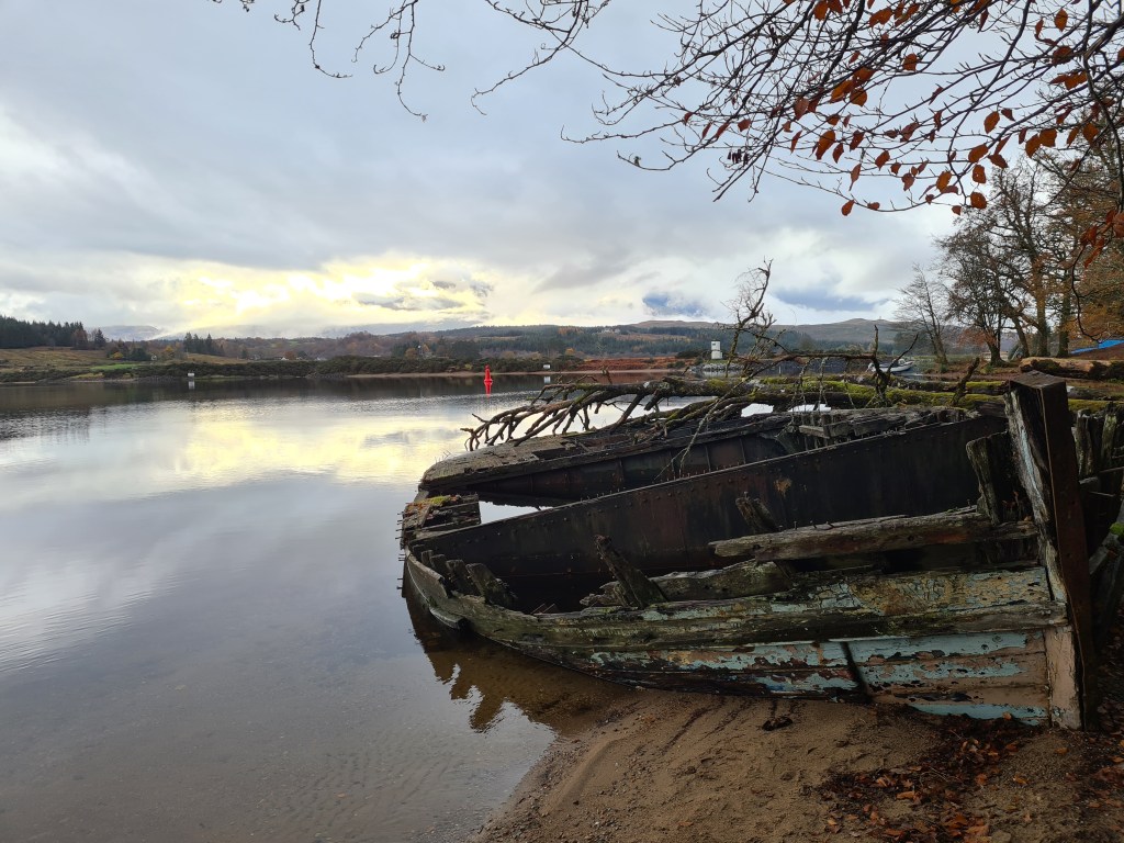 Looking back toward Gairlochy the little white 'pepperpot' lighthouse marks the end of Loch Lochy, where boats enter the Caledonian Canal, where I camped last night 