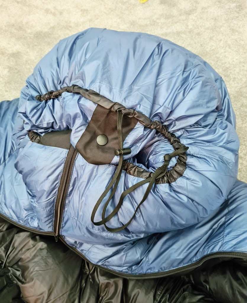 Katabatic Flex 15 degree quilt. Zip slightly done up, cord slightly tightened on footboard, popper snapped closed
