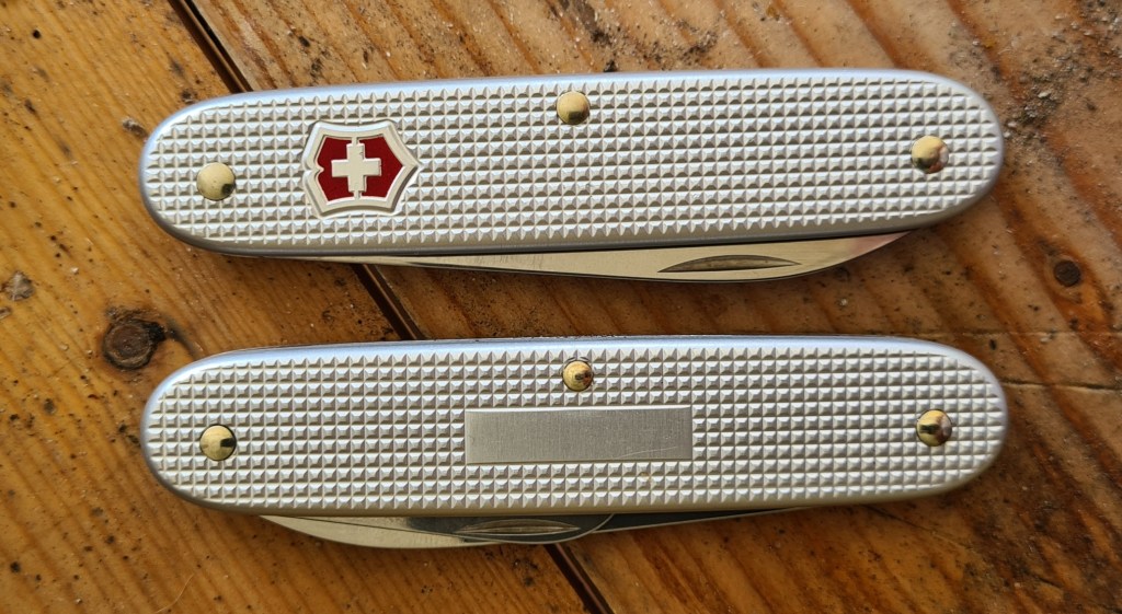 Victorinox 'Swiss Cross' appears on one scale and a blank plate for personal etching on the other