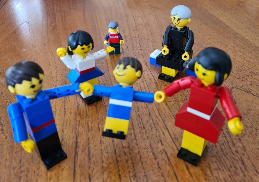 The small Lego Hiker from 2008 does appear slightly peeved with the 1974 family blocking his way